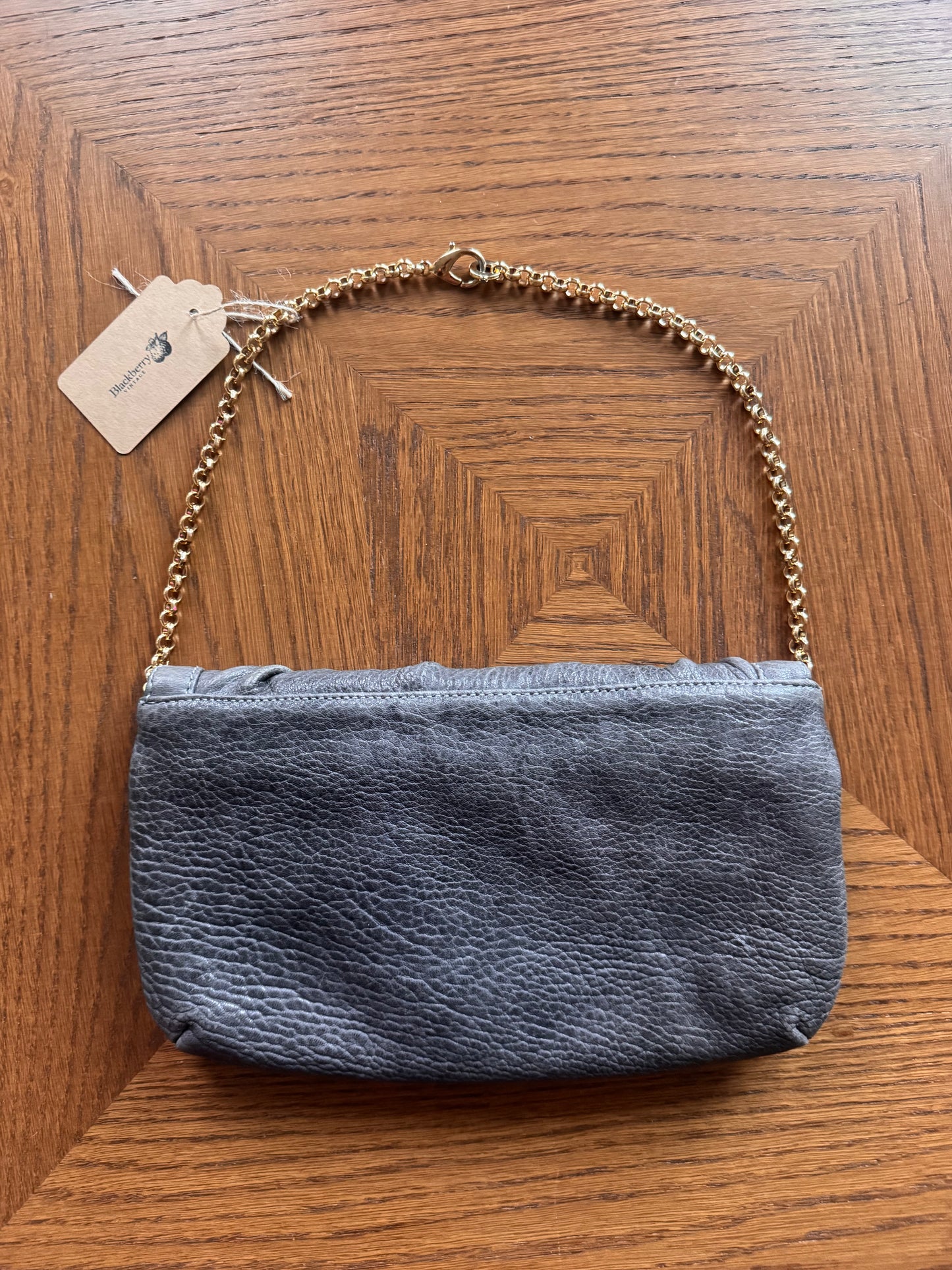 Ruched gray leather clutch