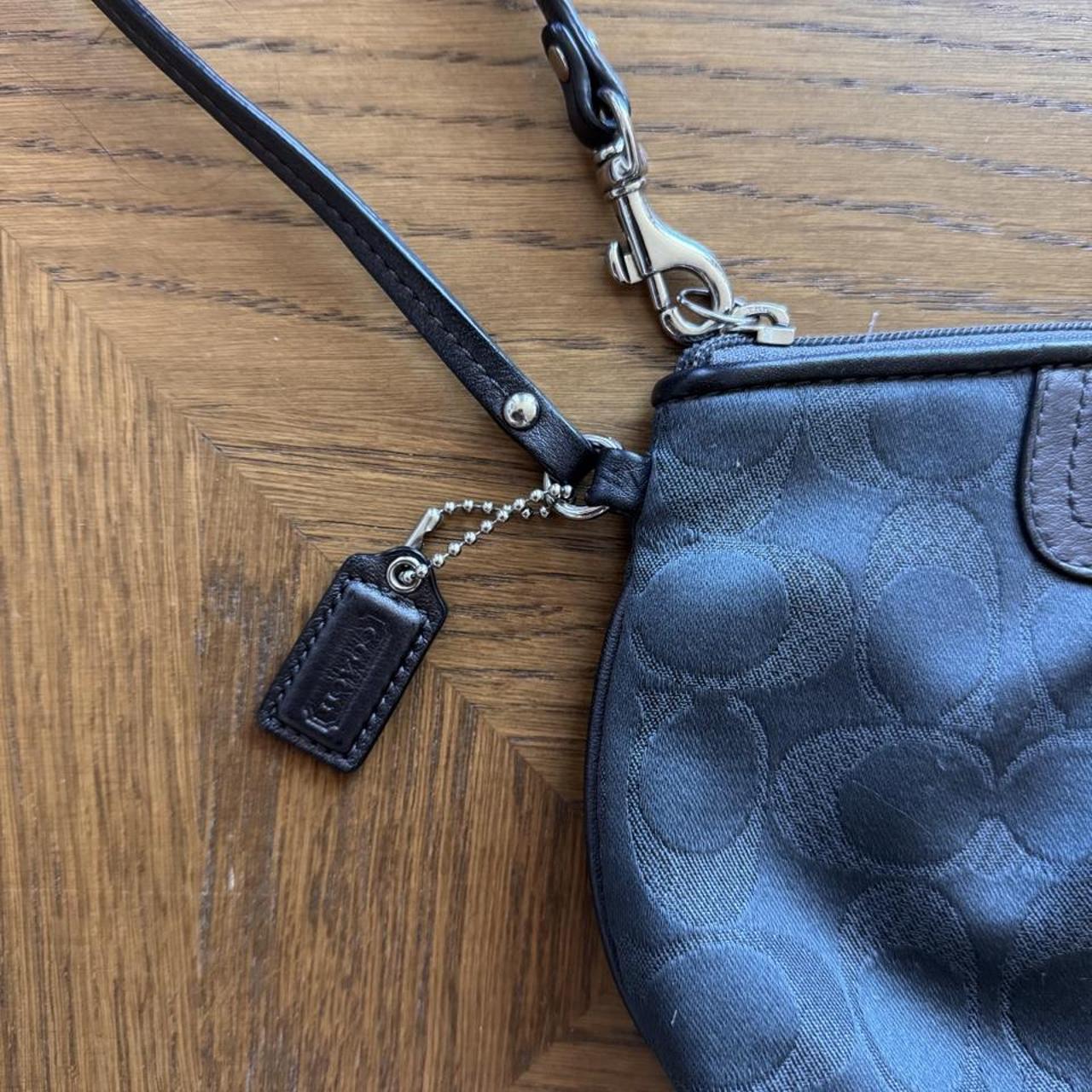 Coach black/gray monogram wristlet